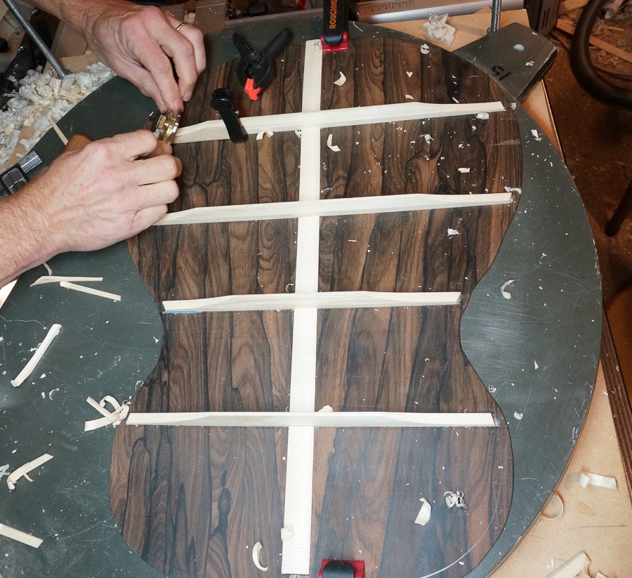 Last scalloped brace being trimmed on back braces.jpg